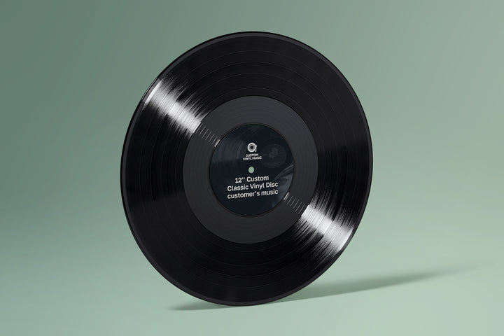 Black vinyl record on a green background