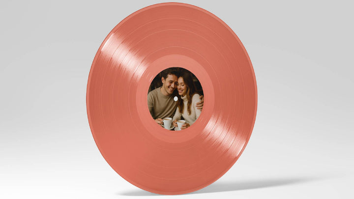 Vinyl record with a cutout revealing a couple and cups on a white background