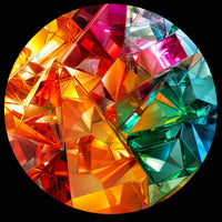 A circular arrangement of faceted gemstone-like shapes in a rainbow spectrum of colors including red, orange, yellow, green, blue, and purple, set against a solid black background.